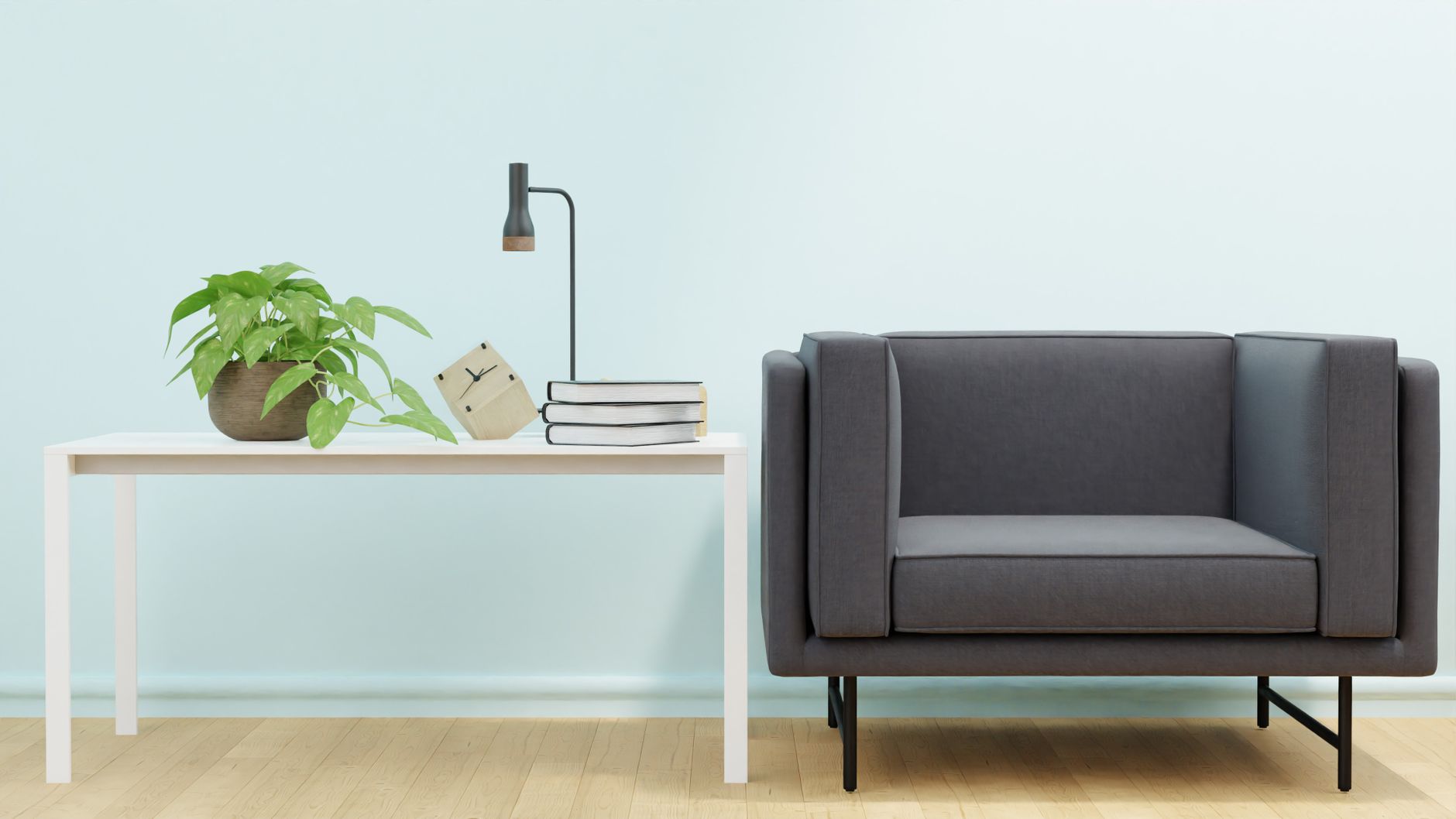 Elegant living room setup with a modern sofa, white table, and indoor plant.